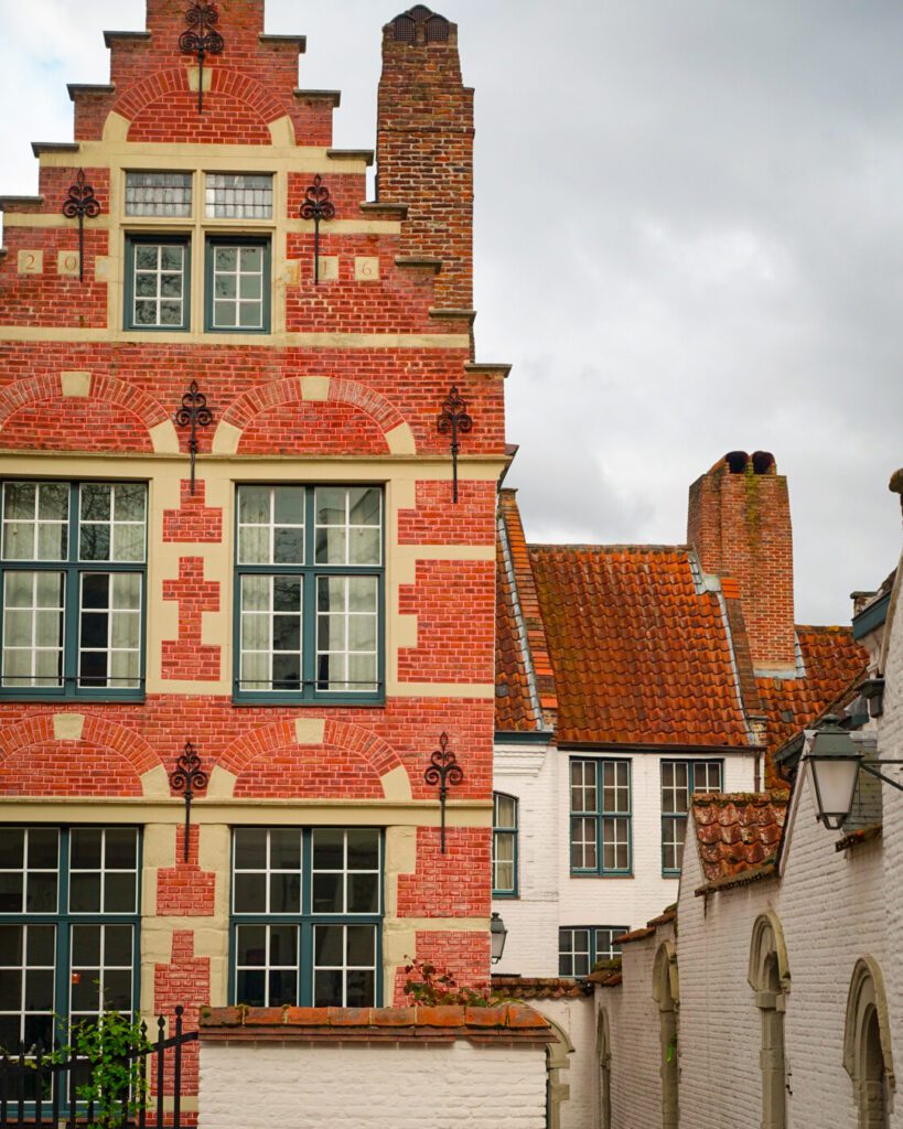 A picture of a brick house at the Begijnhof in Kortrijk , Belgium- a collection of terraced houses on cobbled streets
