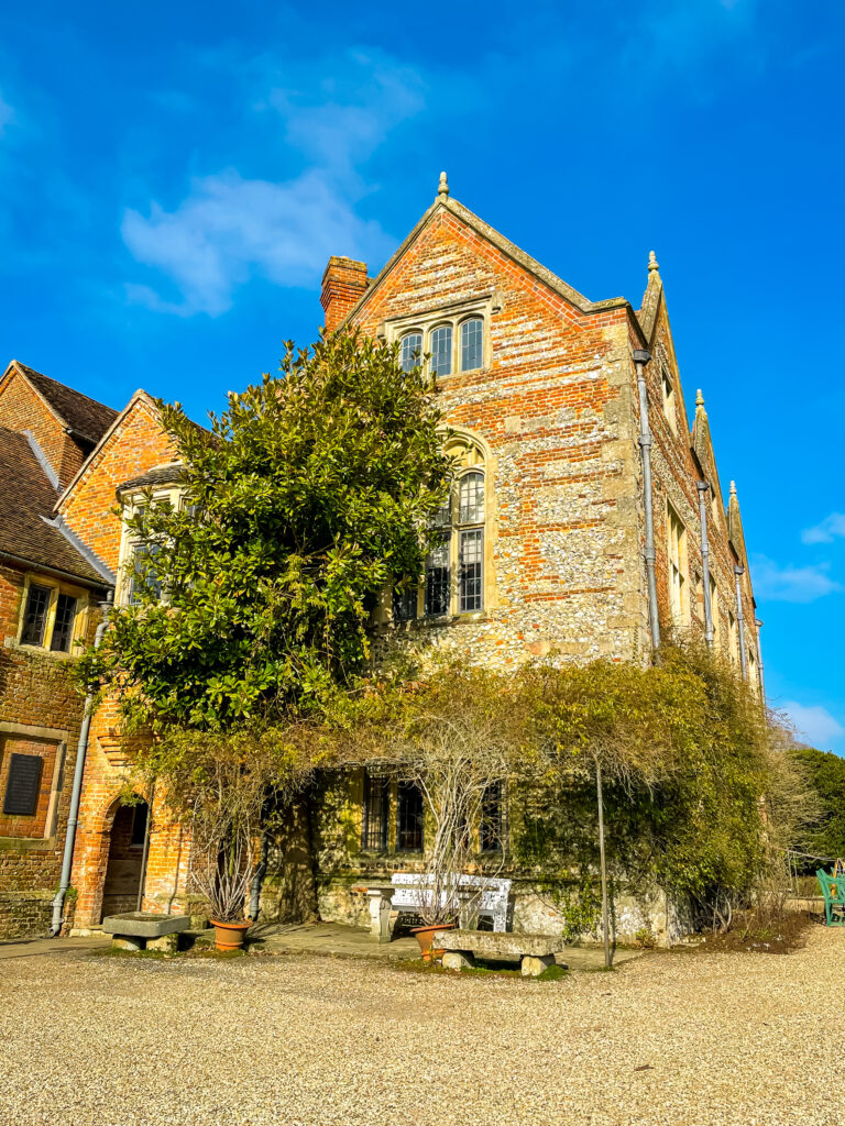 The house at Greys court is built out of orange brick, with beautiful shrubbery hanging down from the walls. There is a small wooden bench in-front of the entrance to the House, where you can sit and look out onto the Oxfordshire countryside.