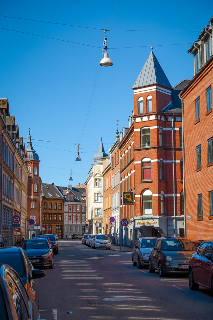 The city of Aalborg invites through its cycling-friendly nature as well as traditional red-brick coloured houses, which line the streets.