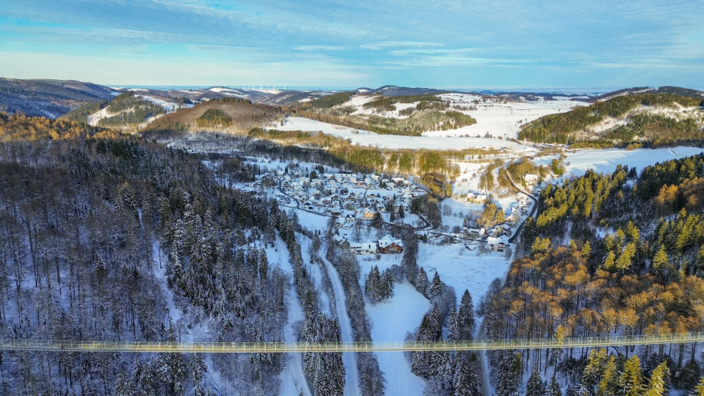 Skywalk is the longest suspension bridge in Willingen, with beautiful views onto the village. The bridge is set over a backdrop of a snowy landscape and is suspended 100m above the ground.