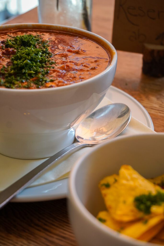 Chilli Sin Carne (on the left) and a side of tortilla chips (on the right) at Krawummel in Muenster - a relaxed style restaurant where you pay and collect your order at the counter. It's one of the best value restaurants in the entire city - with a meal costing less than 10 euros on average.