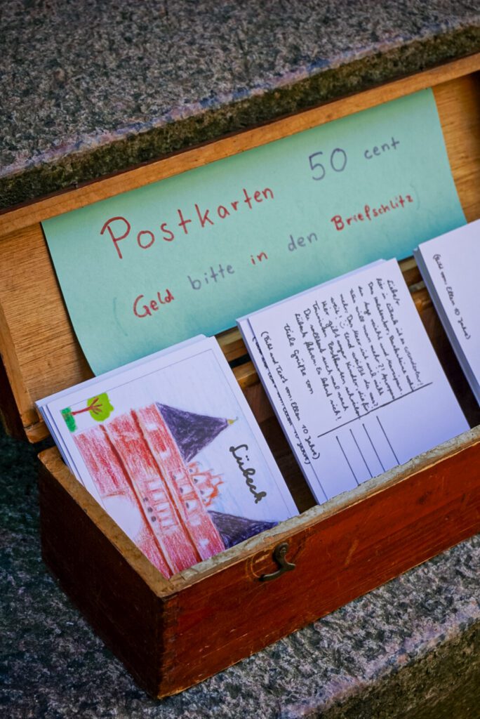 On the streets of Lübeck, look out for postcard boxes, where you can purchase handcrafted postcards for only 50cent.