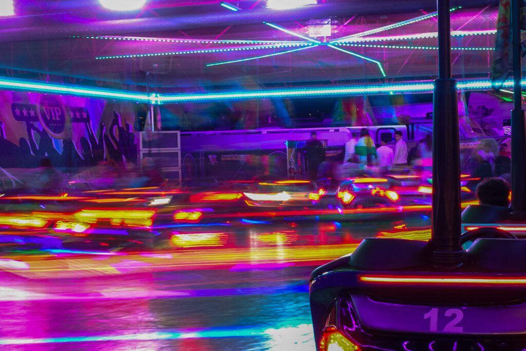 The Autoscooter (in German), also known as the Dodgems, is one of the classic attractions at the Kirmes in Köln. Night time offers a great opportunity for long exposure photos, with colourful lights creating stunning light trails.